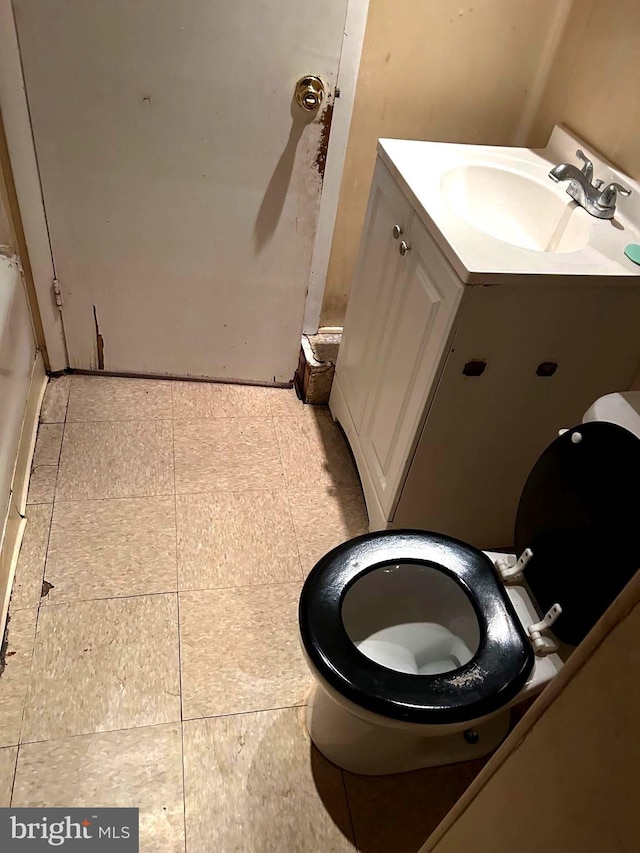 bathroom with vanity and tile patterned flooring