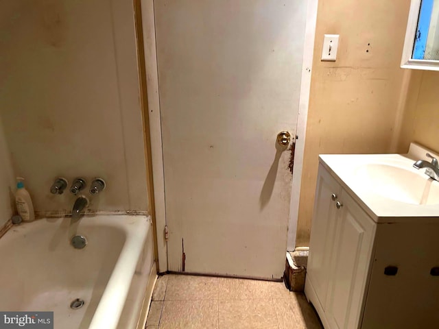 full bath with vanity and a tub