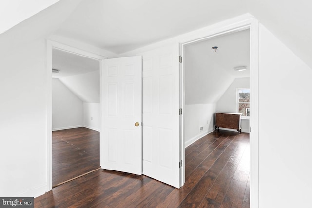 bonus room with baseboards, hardwood / wood-style floors, and lofted ceiling