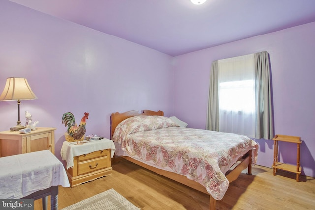 bedroom featuring light wood finished floors