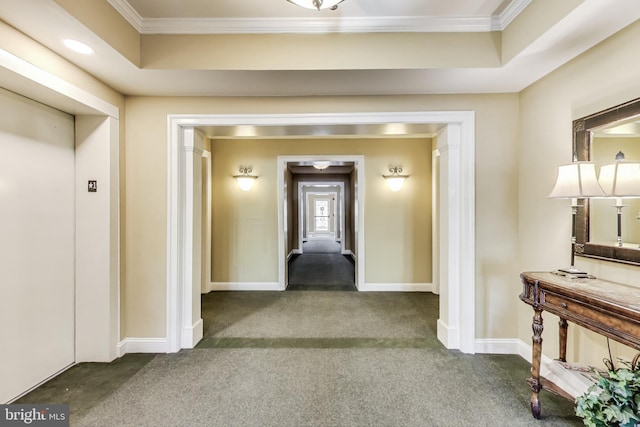 hall featuring crown molding, carpet floors, baseboards, and elevator