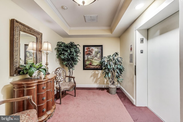 sitting room featuring visible vents, ornamental molding, elevator, a raised ceiling, and carpet flooring