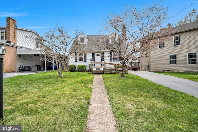 413 W Marble St, Mechanicsburg, PA 17055 - view of front of property with a front lawn, a chimney, and central AC
