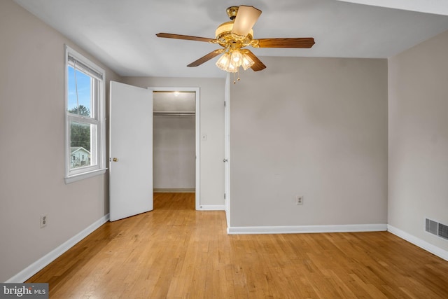 413 W Marble St, Mechanicsburg, PA 17055 - unfurnished bedroom featuring light wood-style flooring, baseboards, a walk in closet, and a closet
