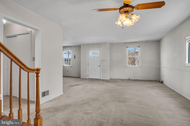 413 W Marble St, Mechanicsburg, PA 17055 - entrance foyer with stairway, carpet, ceiling fan, and baseboards