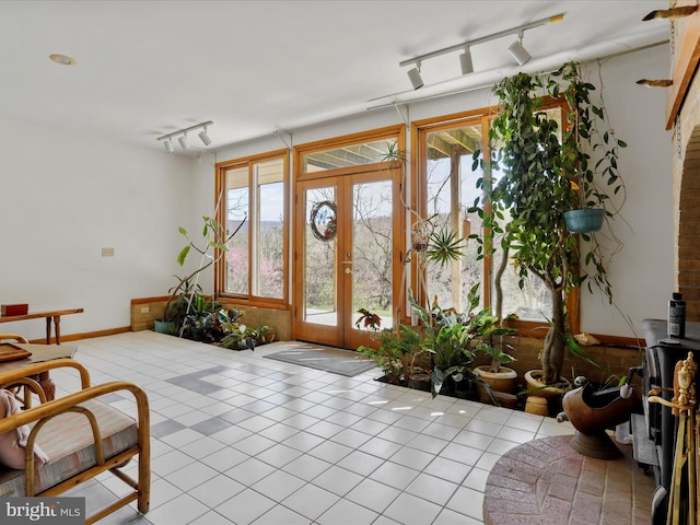 tiled foyer with french doors and track lighting