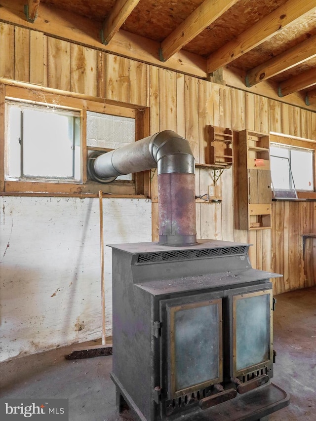 details featuring concrete floors and a wood stove