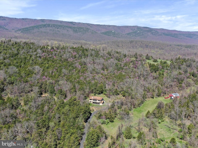 bird's eye view featuring a wooded view and a mountain view