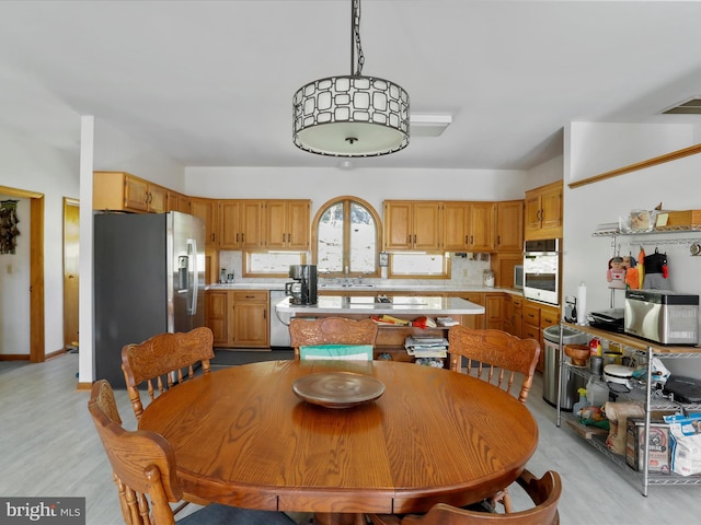 dining area featuring visible vents and light wood-style floors