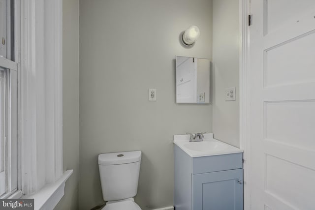 bathroom with toilet and vanity