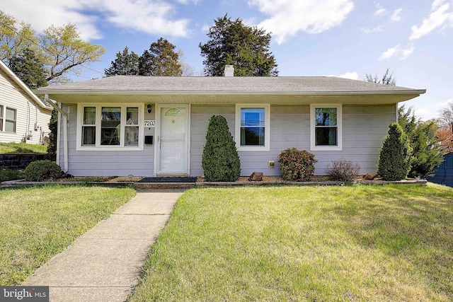 7203 Roanne Dr, Oxon Hill, MD 20745 - view of front of home with a front yard and a shingled roof