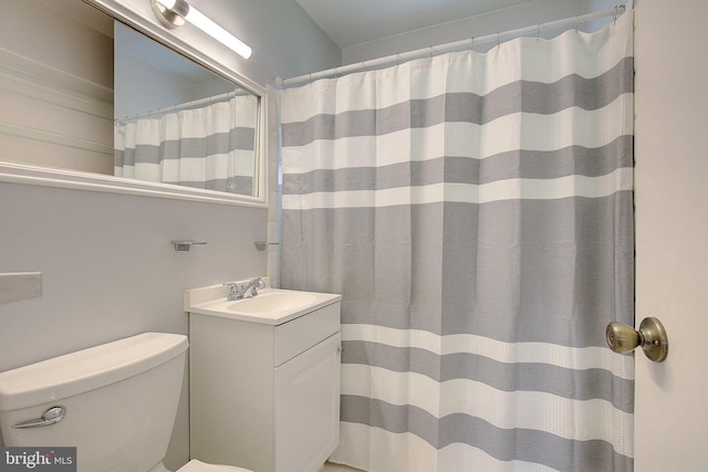 7203 Roanne Dr, Oxon Hill, MD 20745 - bathroom featuring a shower with shower curtain, vanity, and toilet
