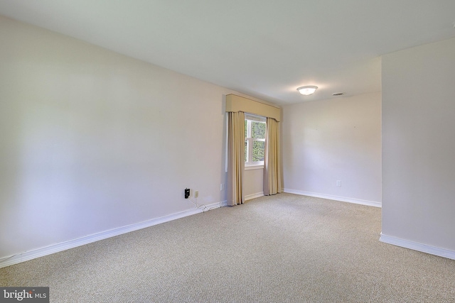 7203 Roanne Dr, Oxon Hill, MD 20745 - spare room with baseboards and light colored carpet