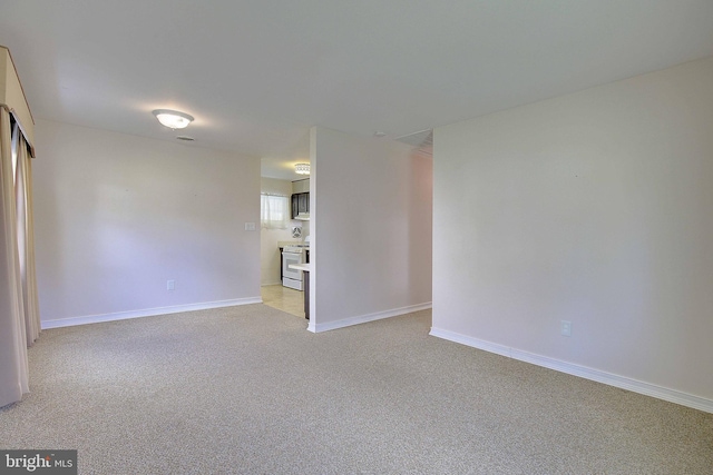 7203 Roanne Dr, Oxon Hill, MD 20745 - unfurnished room with baseboards and light colored carpet