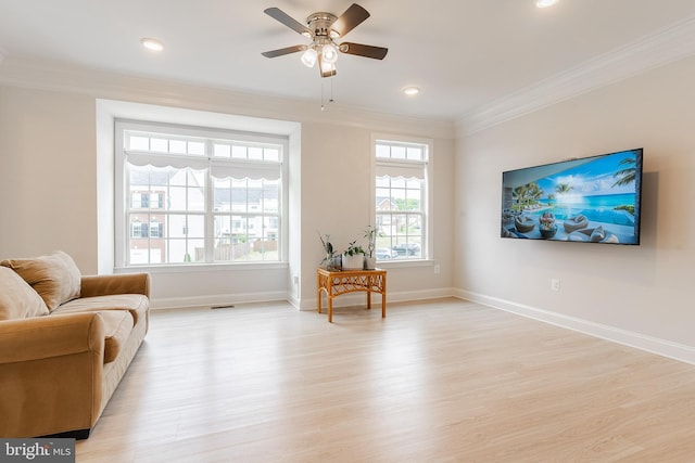 15332 Ballerina Loop, Woodbridge, VA 22193 - living area with crown molding, light wood-style floors, baseboards, a ceiling fan, and recessed lighting