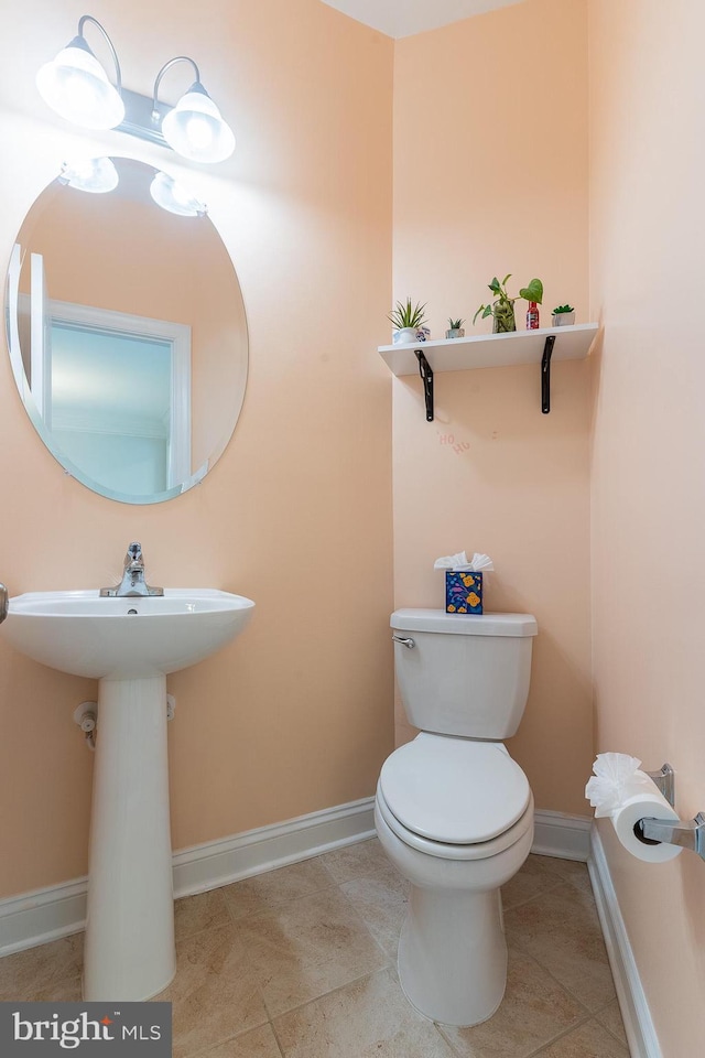 15332 Ballerina Loop, Woodbridge, VA 22193 - half bathroom with baseboards, toilet, and tile patterned floors