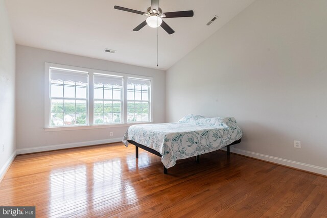 15332 Ballerina Loop, Woodbridge, VA 22193 - bedroom featuring lofted ceiling, wood finished floors, baseboards, and a ceiling fan