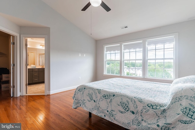 15332 Ballerina Loop, Woodbridge, VA 22193 - bedroom featuring lofted ceiling, light wood finished floors, baseboards, ceiling fan, and ensuite bath