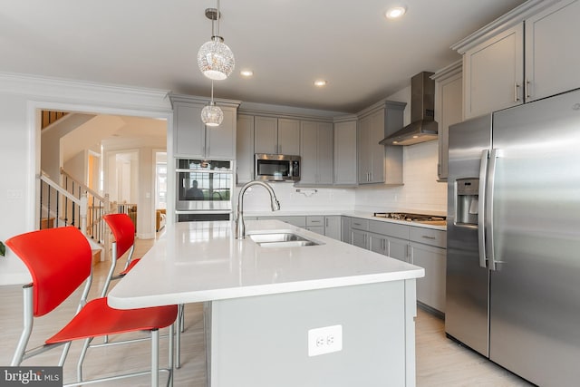 15332 Ballerina Loop, Woodbridge, VA 22193 - kitchen with stainless steel appliances, wall chimney exhaust hood, a sink, gray cabinets, and light countertops