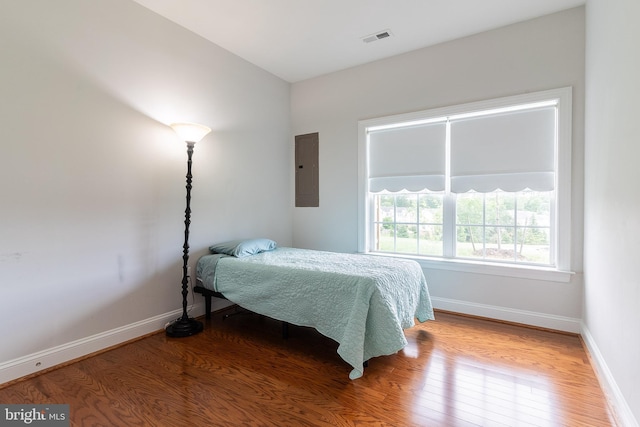 15332 Ballerina Loop, Woodbridge, VA 22193 - bedroom featuring electric panel, wood finished floors, and baseboards