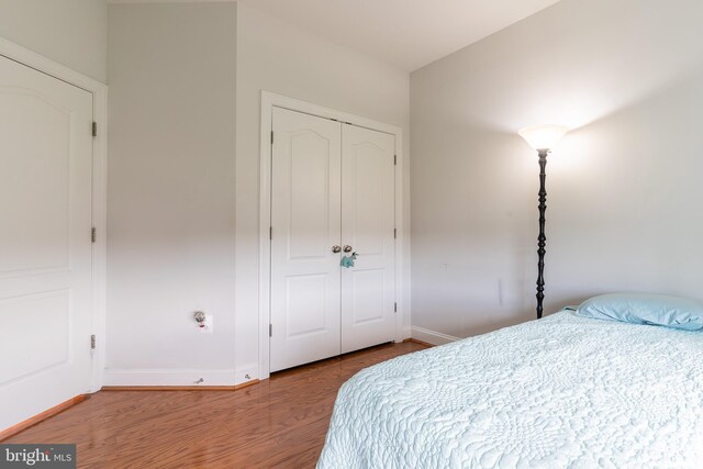 15332 Ballerina Loop, Woodbridge, VA 22193 - bedroom with wood finished floors, baseboards, and a closet