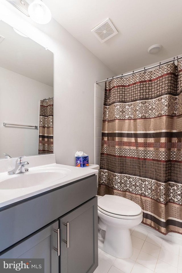 15332 Ballerina Loop, Woodbridge, VA 22193 - bathroom with toilet, vanity, tile patterned floors, and curtained shower