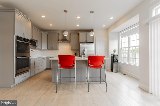 15332 Ballerina Loop, Woodbridge, VA 22193 - kitchen featuring gray cabinets, appliances with stainless steel finishes, light wood-style flooring, plenty of natural light, and recessed lighting
