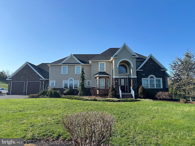 121 Rich Valley Rd, Mechanicsburg, PA 17050 - craftsman inspired home featuring a garage, stucco siding, driveway, and a front yard