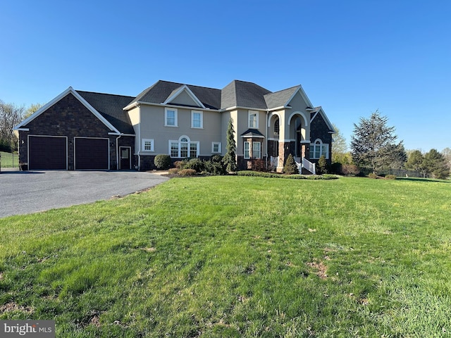 121 Rich Valley Rd, Mechanicsburg, PA 17050 - view of front facade featuring aphalt driveway, a front yard, and a garage