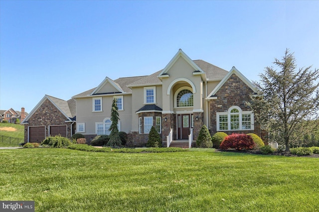 121 Rich Valley Rd, Mechanicsburg, PA 17050 - traditional-style home with a garage, stucco siding, a front lawn, and stone siding