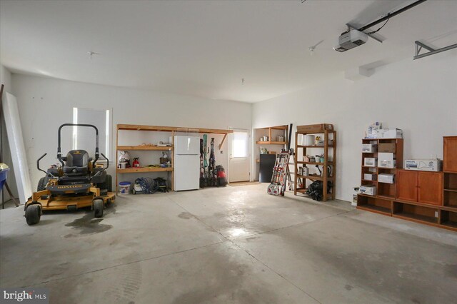 121 Rich Valley Rd, Mechanicsburg, PA 17050 - garage featuring freestanding refrigerator and a garage door opener
