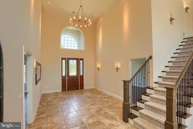 121 Rich Valley Rd, Mechanicsburg, PA 17050 - foyer with baseboards, ornamental molding, an inviting chandelier, a high ceiling, and stairs