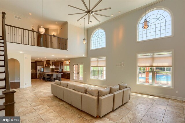 121 Rich Valley Rd, Mechanicsburg, PA 17050 - living room with a high ceiling, visible vents, and ornamental molding