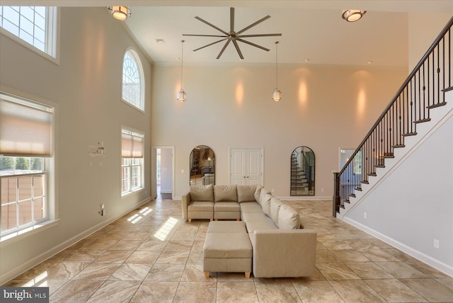 121 Rich Valley Rd, Mechanicsburg, PA 17050 - living area with baseboards, stairs, a high ceiling, and a healthy amount of sunlight