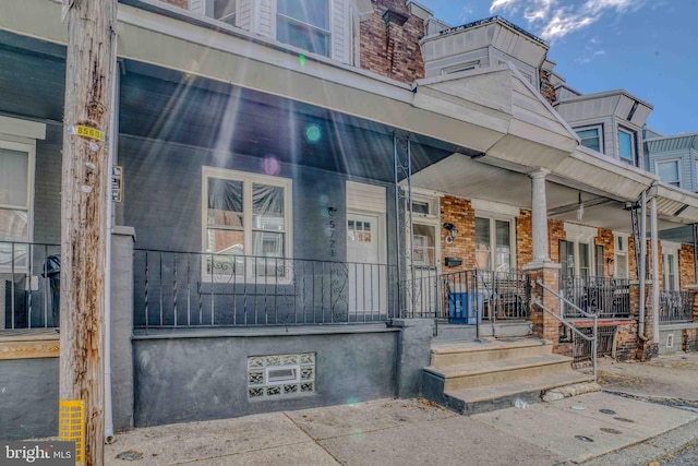 property entrance featuring covered porch