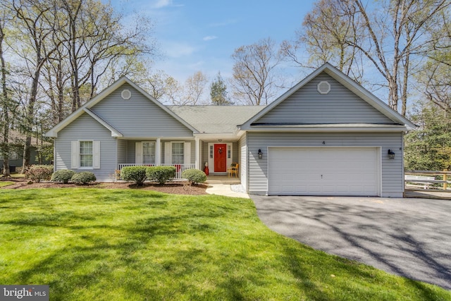 ranch-style house with a front lawn, covered porch, a garage, and aphalt driveway