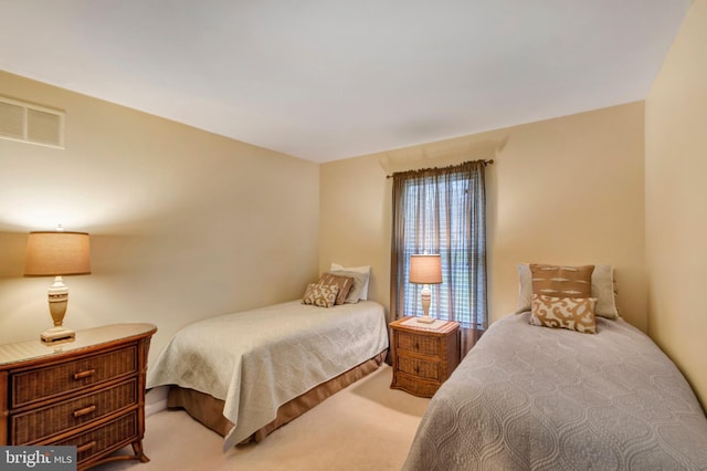 bedroom featuring carpet flooring and visible vents