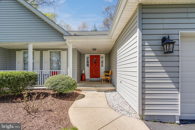doorway to property with covered porch