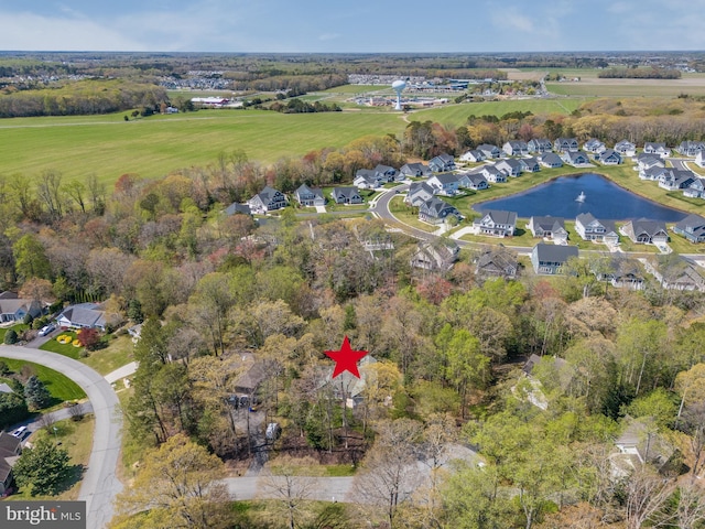 bird's eye view featuring a residential view and a water view