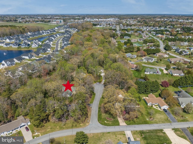 bird's eye view featuring a water view and a residential view