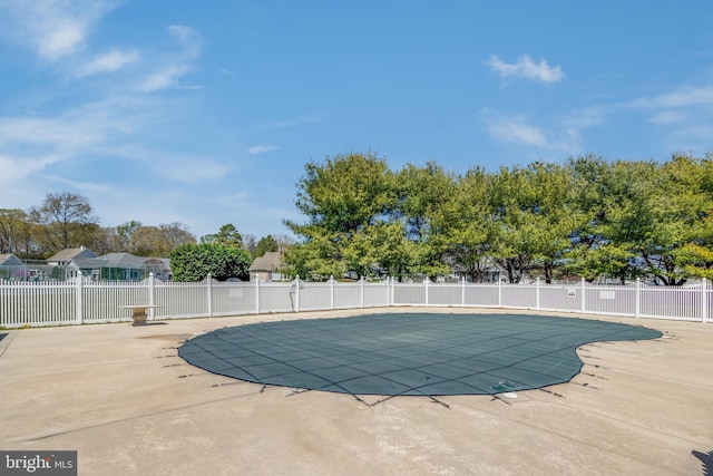 view of pool with a patio, a fenced in pool, and fence