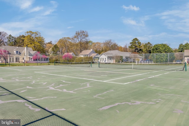view of tennis court with fence