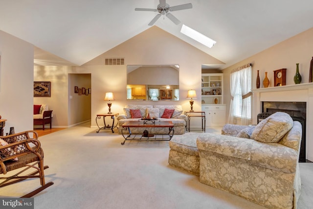 living room featuring visible vents, a ceiling fan, carpet, a fireplace, and high vaulted ceiling