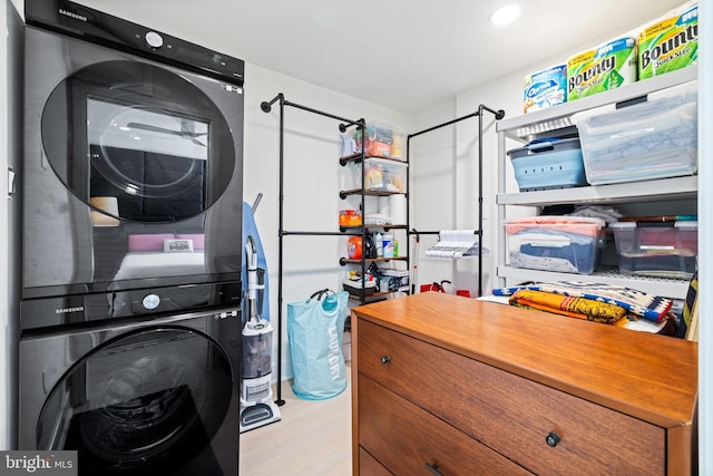 331 S 2nd St, Philadelphia, PA 19106 - laundry room featuring laundry area, wood finished floors, and stacked washer and clothes dryer