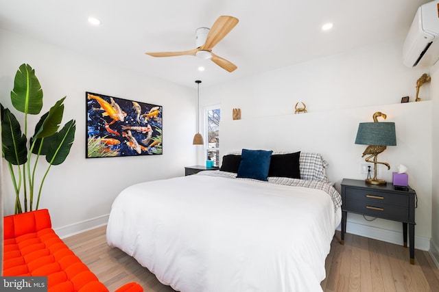 331 S 2nd St, Philadelphia, PA 19106 - bedroom featuring light wood-style flooring, recessed lighting, and a wall mounted air conditioner