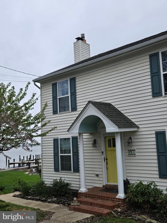 view of front of house with a chimney