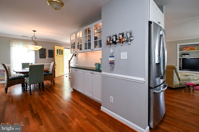 kitchen with stainless steel fridge with ice dispenser, glass insert cabinets, ornamental molding, white cabinetry, and dark wood-style flooring