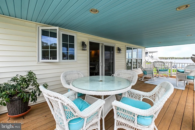 wooden deck with outdoor dining space