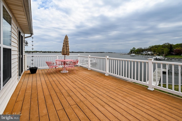 deck featuring a water view