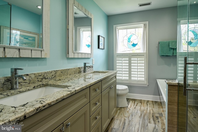 full bathroom featuring a sink, visible vents, baseboards, and toilet